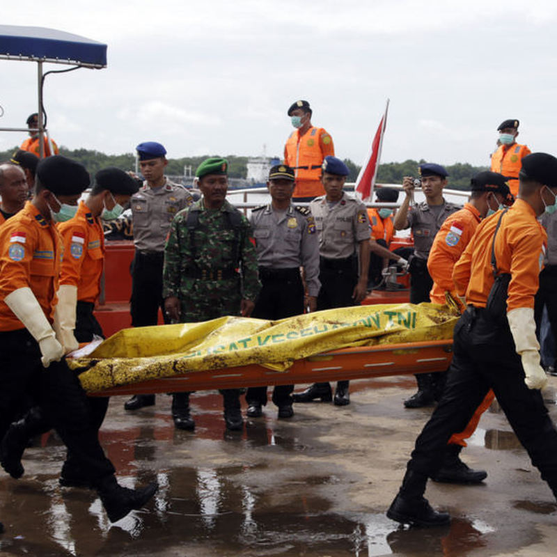 Dead AirAsia pilot found strapped to seat in cockpit ...