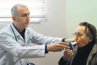 A doctor examining carbon monoxide levels of a smoker to determine her smoking rate. Patients are administered free medicine to quit smoking based on their smoking frequency and if no other treatment options are suitable.  