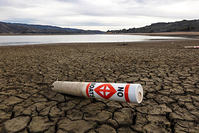 A warning buoy sits on the dry, cracked bed of Lake Mendocino near Ukiah, California  AP Photo