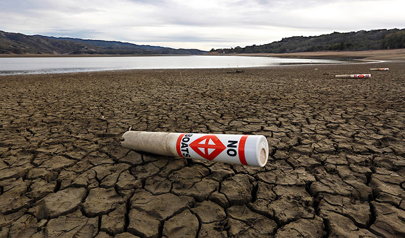 A warning buoy sits on the dry, cracked bed of Lake Mendocino near Ukiah, California  AP Photo