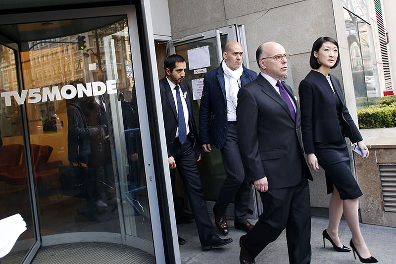 French Interior Minister, Culture minister leave French television network TV5Monde HQ in Paris on April 9  AFP Photo