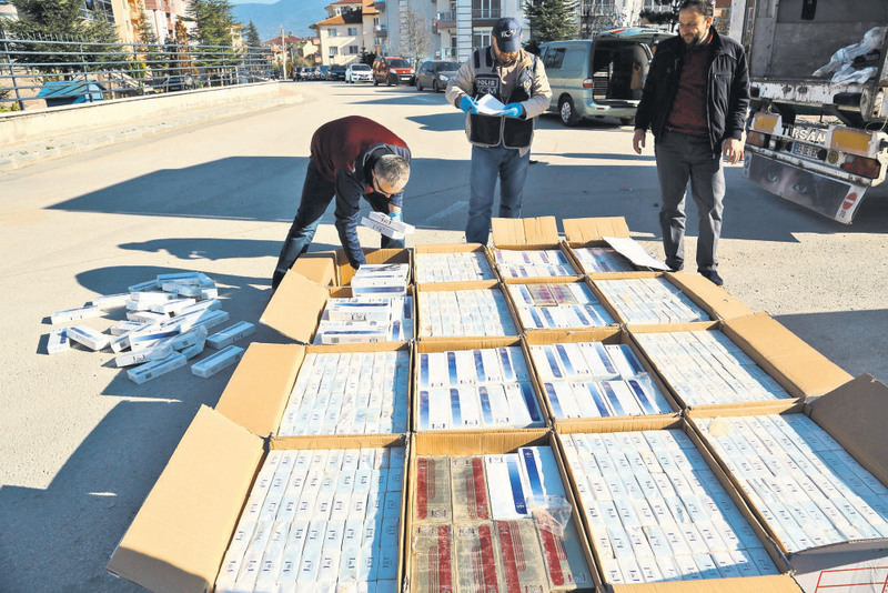 Police in the city of Bolu sorting out smuggled cigarettes found in a truck. Cigarette smuggling is a common concern for both Turkey and Bulgaria.