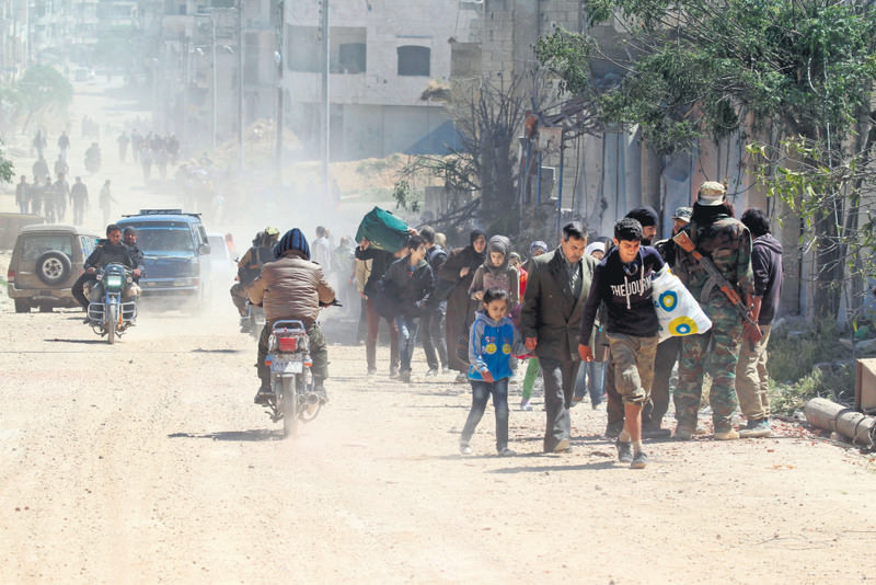 Civilians flee from Idlib after al-Nusra militants seized the city along with moderate opposition groups.