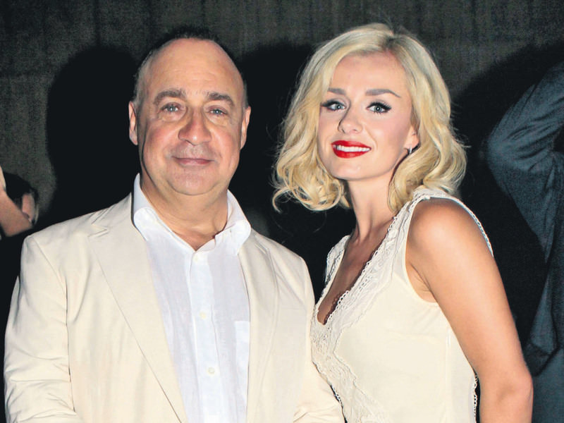 Len Blavatnik, pictured with singer Katherine Jenkins, has made a fortune in a hedge fund deal.