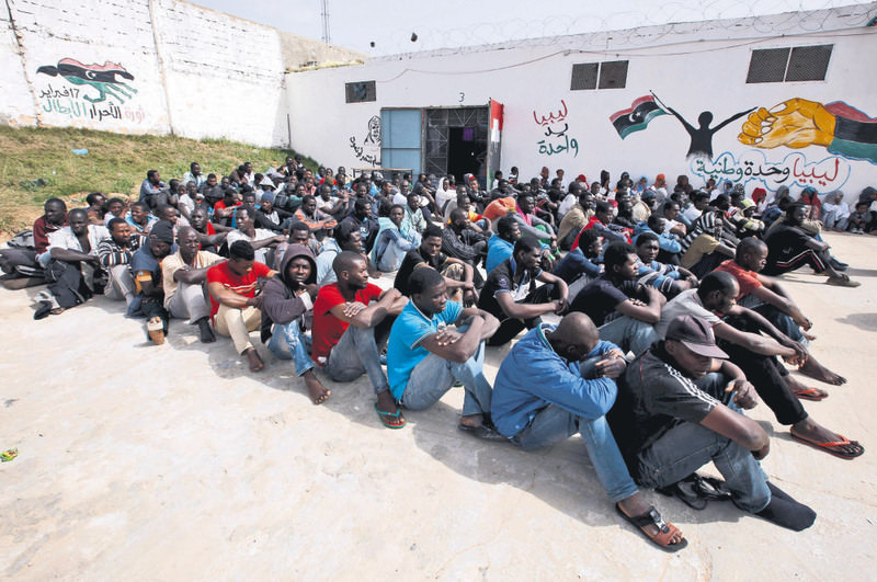 Migrants are not allowed to leave the detention center near Tripoli.
