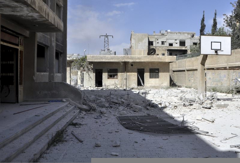 A view of the damage at a school, after what activists said were eight barrel bombs thrown by forces loyal to Syria's President Bashar Al-Assad, in Yarmouk camp April 14, 2015 (Reuters Photo)