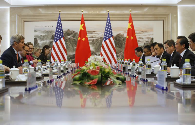 U.S. Secretary of State John Kerry, left, holds a talk with Chinese Foreign Minister Wang Yi, second right, in Beijing, China (AP Photo)