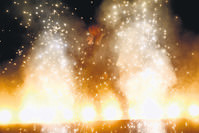 Kanye West gets booed during his smoky performance. 