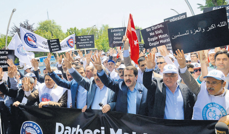 Demonstrators from Memur-Sen, a prominent labor union, made Rabaa signs at a rally condemning the death sentence for Morsi and others outside the  Egyptian Embassy in Ankara.