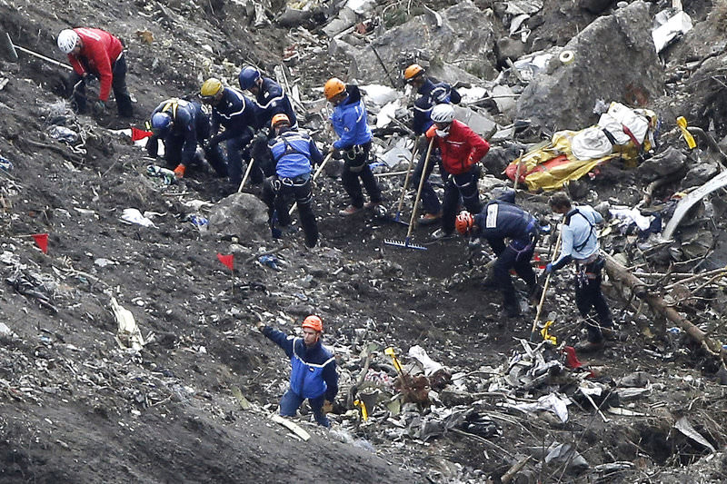  In this March 26, 2015 file photo, rescue workers work on debris of the Germanwings jet at the crash site near Seyne-les-Alpes, France (AP Photo)