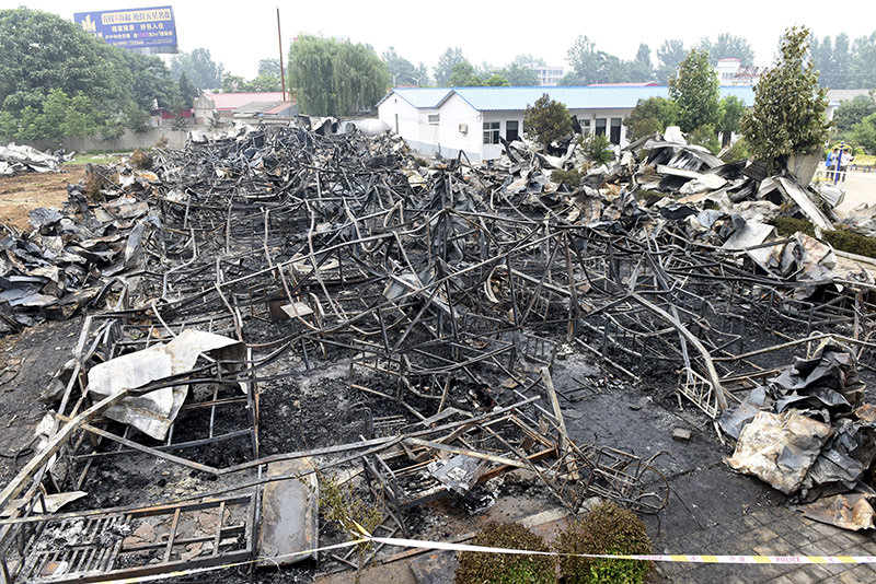 This photo released by China's Xinhua News Agency shows a fire-gutted rest home in Pingdingshan, central China's Henan Province Tuesday, May 26, 2015 (AP Photo)