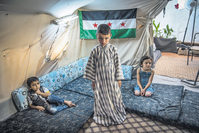 Syrian children at a refugee camp in the city of Hatay. Turkey is one of the countries with strong ties to Syria due to a shared history, and pursues an open-door policy for Syrian refugees staying in camps along the border.