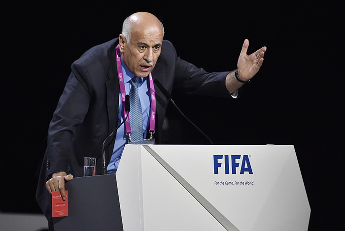 President of the Palestinian FA Jibril Rajoub shows a red card as he speaks during the 65th FIFA Congress on May 29, 2015 in Zurich (AFP Photo)