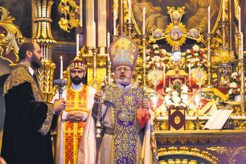 Archbishop Aram Ateu015fyan (center), acting head of the patriarchate, presiding over a religious service at Surp Asdvadzadzin church in Istanbul on April 25.