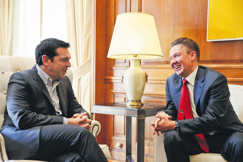 Greek PM Tsipras (L) welcomes Russian Gazprom CEO Miller at his office in Athens April 21. During talks in Moscow, Tsipras expressed interest in Greece's participation in a pipeline that would carry Russian gas to Europe through its territory.