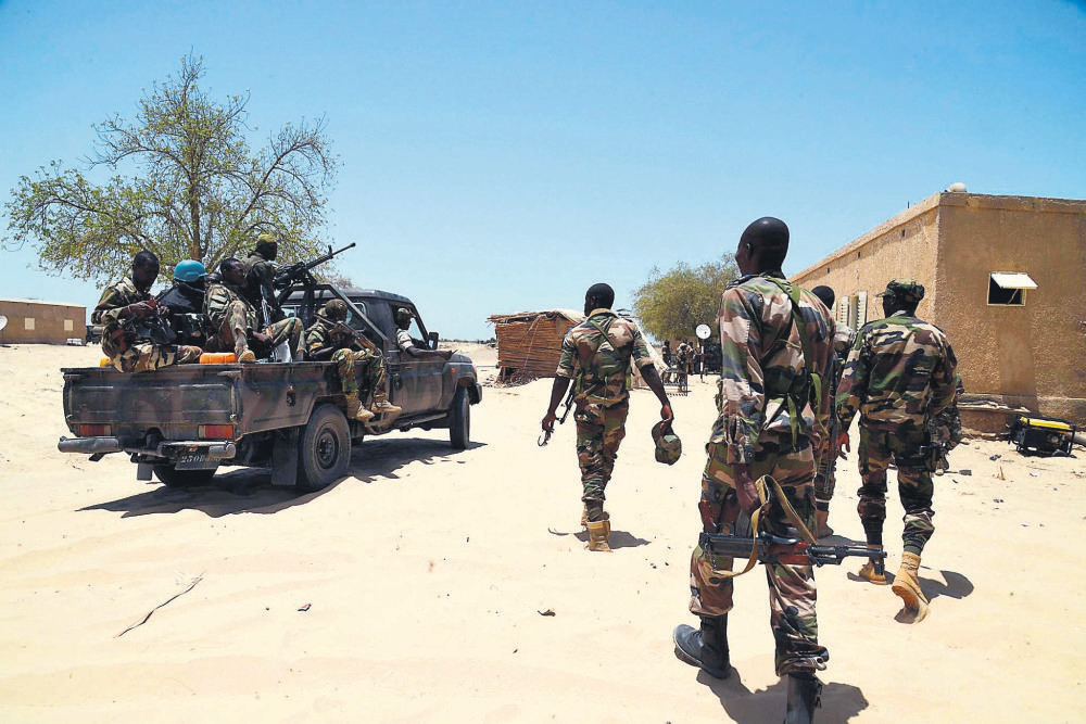 Nigerien soldiers patrol the Nigerian border near the south eastern city of Bosso.