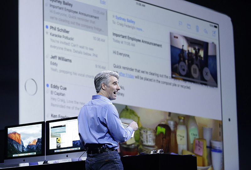 Craig Federighi, Apple senior vice president of Software Engineering, demonstrates the multitask feature on an iPad at the Apple Worldwide Developers Conference in San Francisco. (AP Photo)