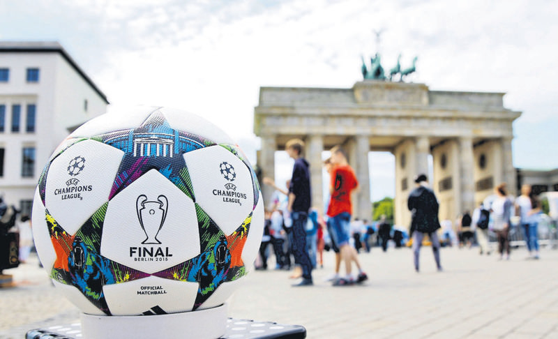 The official match ball for the UEFA Champions League final, produced by German sportswear firm Adidas, is pictured in front of the Brandenburg gate.