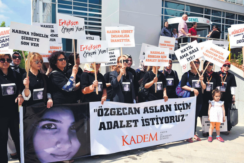 Activists from the NGO KADEM holding a banner reading ,Justice For u00d6zgecan, with a photo of the slain woman. It is a high-profile trial as the murder had triggered nationwide protests against violence targeting women.