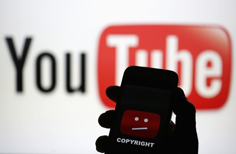 A picture illustration shows a photo taken of a YouTube error logo, displayed on a cell phone in front of a YouTube logo on an LCD screen, in central Bosnian town of Zenica, early June 18, 2014 (Reuters Photo)