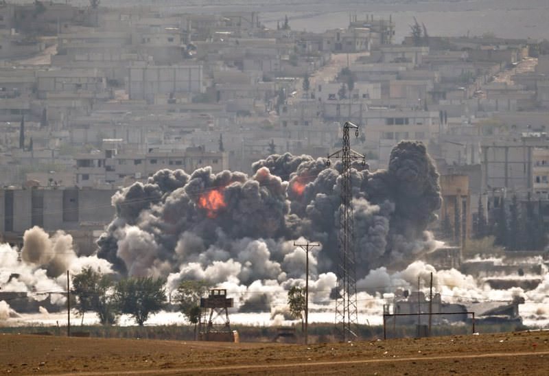 Smoke and flames rise from an ISIS position in Kobani during airstrikes by the U.S. led coalition seen from the outskirts of Suruu00e7 on Oct. 28, 2014.
