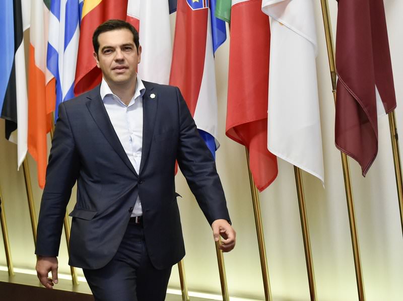 Greek Prime Minister Alexis Tsipras arrives to speak to journalists after an EU summit at the EU headquarters in Brussels on June 26, 2015 (AFP Photo)