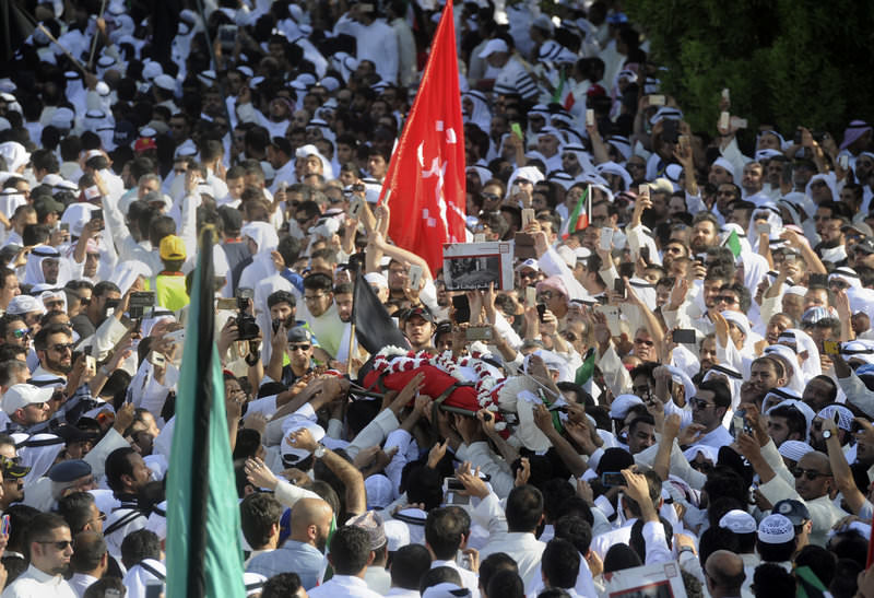  Thousands of Sunnis and Shiites from across the country take part in a mass funeral procession for 27 people killed in a mosque attack in Kuwait, Saturday, June 27, 2015 (AP Photo)