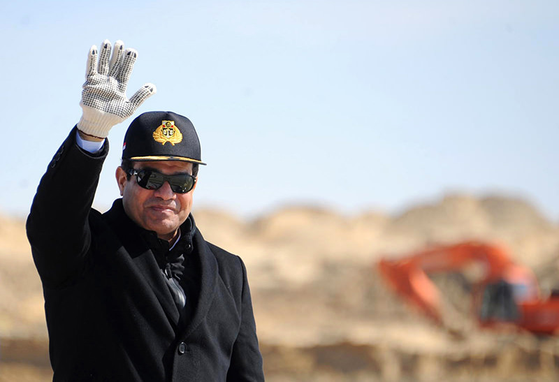 In this Sunday, Feb. 22, 2015, file photo, provided by the Egyptian Presidency, Egyptian President Abdel-Fattah el-Sissi waves during a visit to the Suez Canal in Ismailia, Egypt (AP Photo)