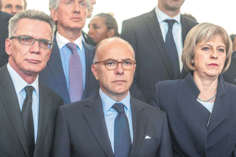 French Interior Minister Bernard Cazeneuve and British Home Secretary Theresa May.