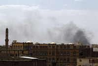 Smoke rises above the city after airstrikes allegedly carried out by the Saudi-led coalition hit positions held by the Houthis in Sana'a, Yemen, 05 July 2015 (EPA Photo)