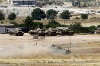 A Turkish Army vehicle leaves its base in Suruu00e7, bordering the Syrian town of Suruu00e7.