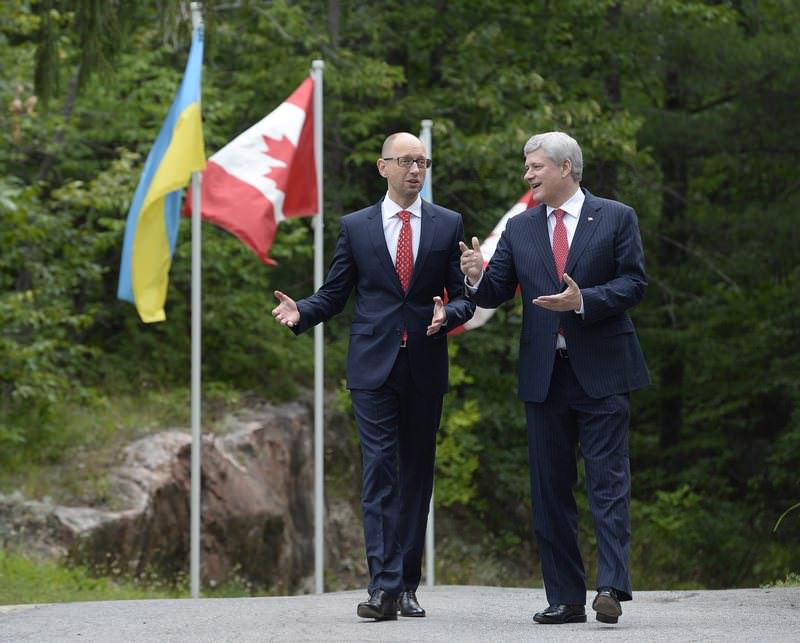 Canadian Prime Minister Stephen Harper meets with Ukrainian Prime Minister Arseniy Yatsenyuk at Willson house in Chelsea, Quebec, Canada (AP Photo)