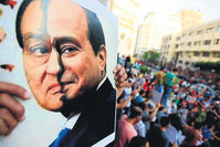 One of the thousands of Egyptians who protest el-Sissi and the coup almost every Friday across the country holds a sign.  