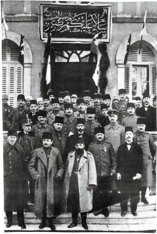 Enver and Cemal Pasha, the leaders of the Commitee of Union and Progress, which seized power after Sultan Abdu00fclhamid II was dethroned, stand in front of other commitee members. Along with Talat Pasha, they were known as the u2018Three Pashas.'