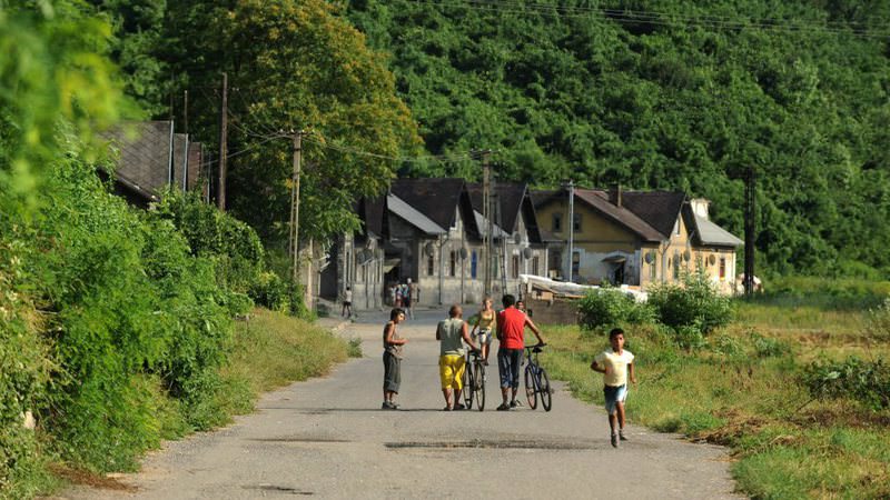 People walk in a street in the Hetes borough of Ozd, 153 kilometers northeast of Budapest, Hungary, July 24, 2010