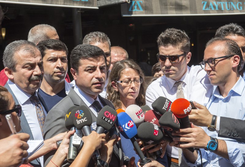 HDP Co-Chairperson Selahattin Demirtau015f speaking to the press outside HDP headquarters in Ankara on Wednesday.