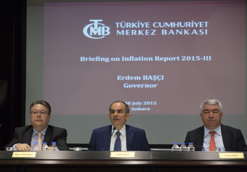 Turkish Central Bank Governor Bau015fu00e7u0131 (C) speaks at a press conference held to announce the third quarter inflation report.