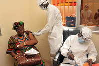 Woman getting vaccinated at a health center in Conakry during the first clinical trials of the VSV-EBOV vaccine against the Ebola virus (AFP Photo)
