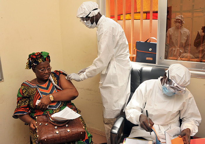 Woman getting vaccinated at a health center in Conakry during the first clinical trials of the VSV-EBOV vaccine against the Ebola virus (AFP Photo)