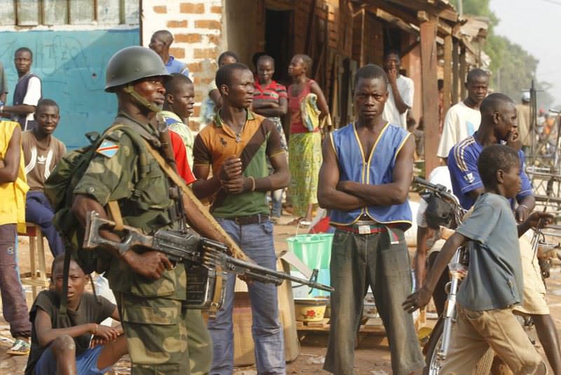 Soldiers from the Democratic Republic of Congo, part of an African peacekeeping force in CAR, patrol a street in Bangui on Feb. 12, 2014.