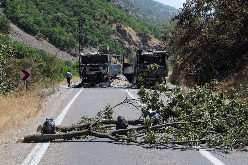Two burnt trucks set on fire by PKK militants in Tunceli, eastern Turkey.