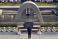Japanese Prime Minister Shinzo Abe bows in front of a memorial for victims of the 1945 atomic bombing during a ceremony to mark the 70th anniversary, at the Hiroshima Peace Memorial Park.