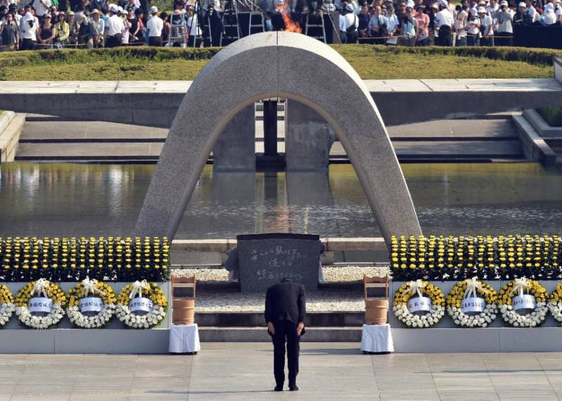 Japanese Prime Minister Shinzo Abe bows in front of a memorial for victims of the 1945 atomic bombing during a ceremony to mark the 70th anniversary, at the Hiroshima Peace Memorial Park.