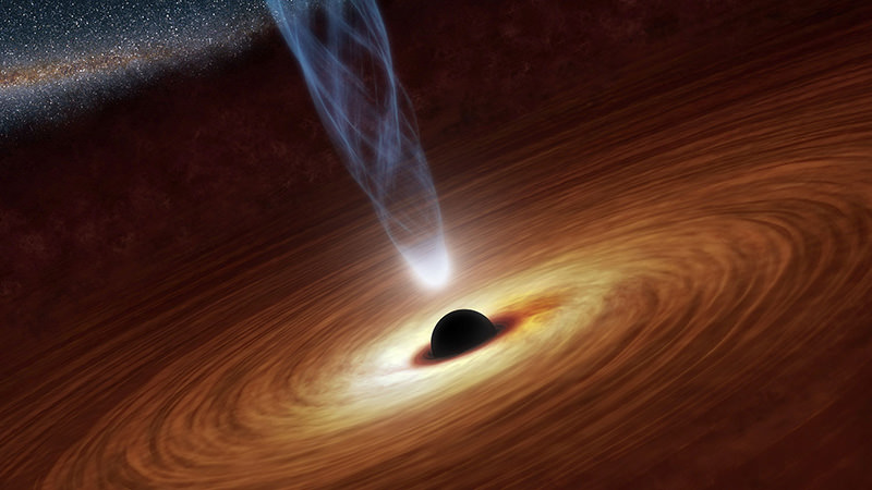 A supermassive black hole with millions to billions times the mass of our sun is seen in an undated NASA artist's concept illustration (Reuters photo)