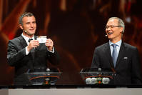  Former Swiss player Alexander Frei, left, shows the draw AZ, as UEFA Director of competitions Giorgio Marchetti smiles at the Grimaldi Forum, in Monaco, Aug. 28, 2015. (AP Photo)