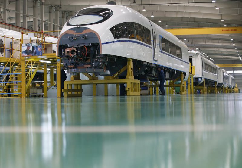 An employee works on a high speed train model CRH380B at a final assembly line of China CNR's Tangshan Railway Vehicle's factory in Tangshan, Hebei province.
