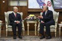 Director General of the International Atomic Energy Agency (IAEA) Yukiya Amano  (L) talks with the head of Iran's Atomic Energy Organization Ali Akbar Salehi, right, talks with in a meeting in Tehran, Iran.