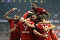 Bayern's Arturo Vidal (L-R), Mario Goetze, Philipp Lahm and Thomas Mueller celebrate the fifth goal of Robert Lewandowski during the German Bundesliga match between Bayern Munich and VfL Wolfsburg at the Allianz Arena in Munich.