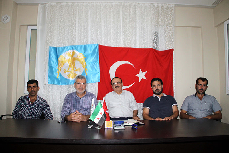 u00d6mer Ceren, advisory board member at the Ankara-based Turkmen group (in the center)  AA Photo