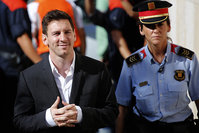 Barcelona F.C. star Lionel Messi, left, arrives at a court to answer questions in a tax fraud case in Gava, near Barcelona, Spain (AP Photo)
